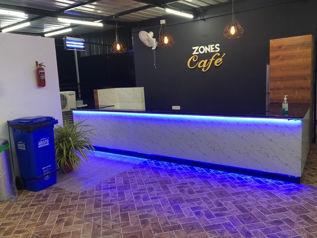 Zones Cafe Kolkata — café and restaurant interior fit-out with custom carpentry and wood paneling by Shazfan Associates